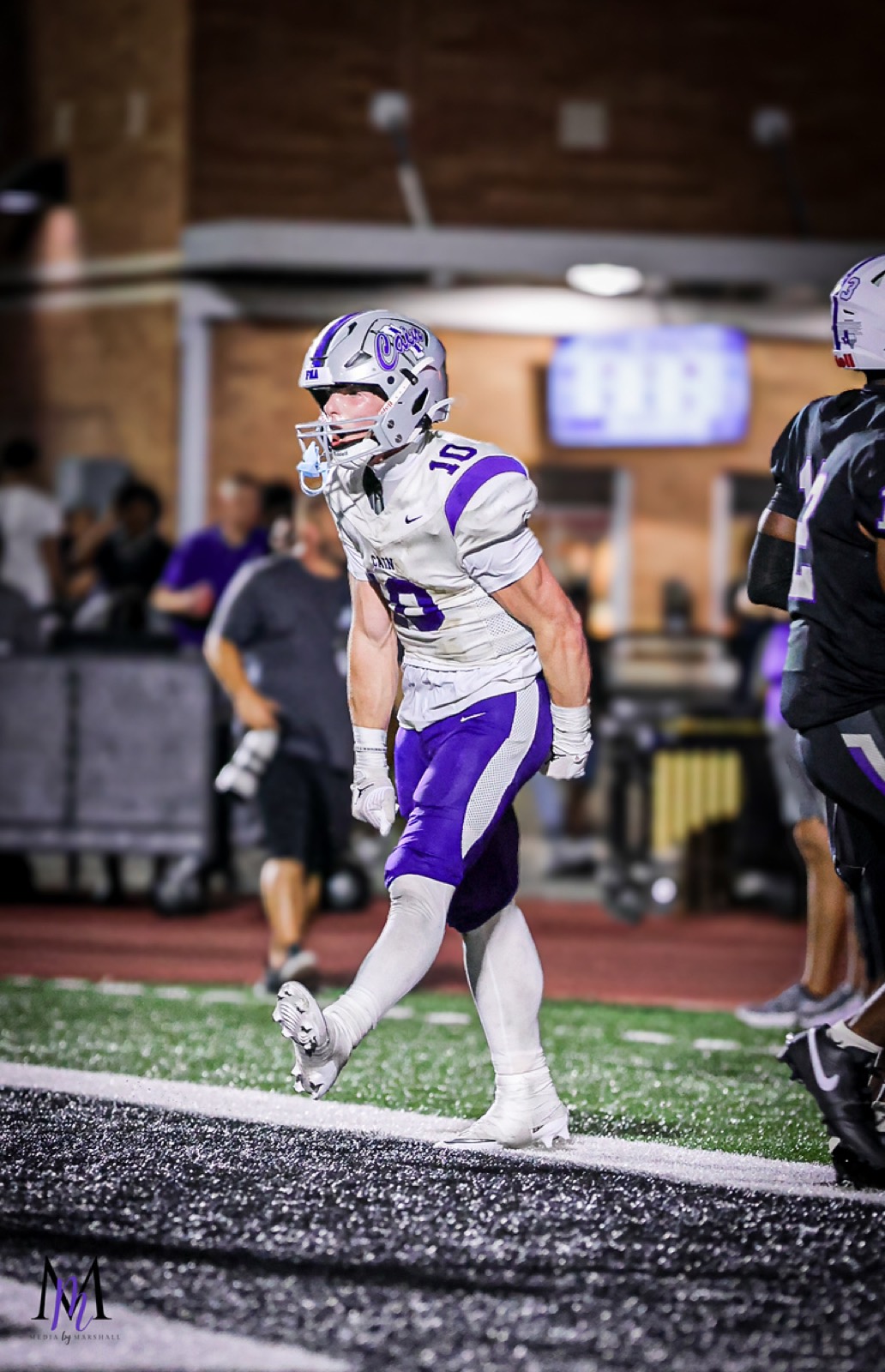 Senior wide receiver Cooper Karns walks toward the sideline after scoring