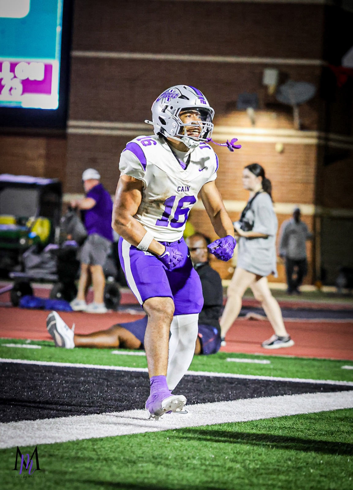 Senior running back Eyan Johnson roars and flexes in the end zone after powering in for a touchdown