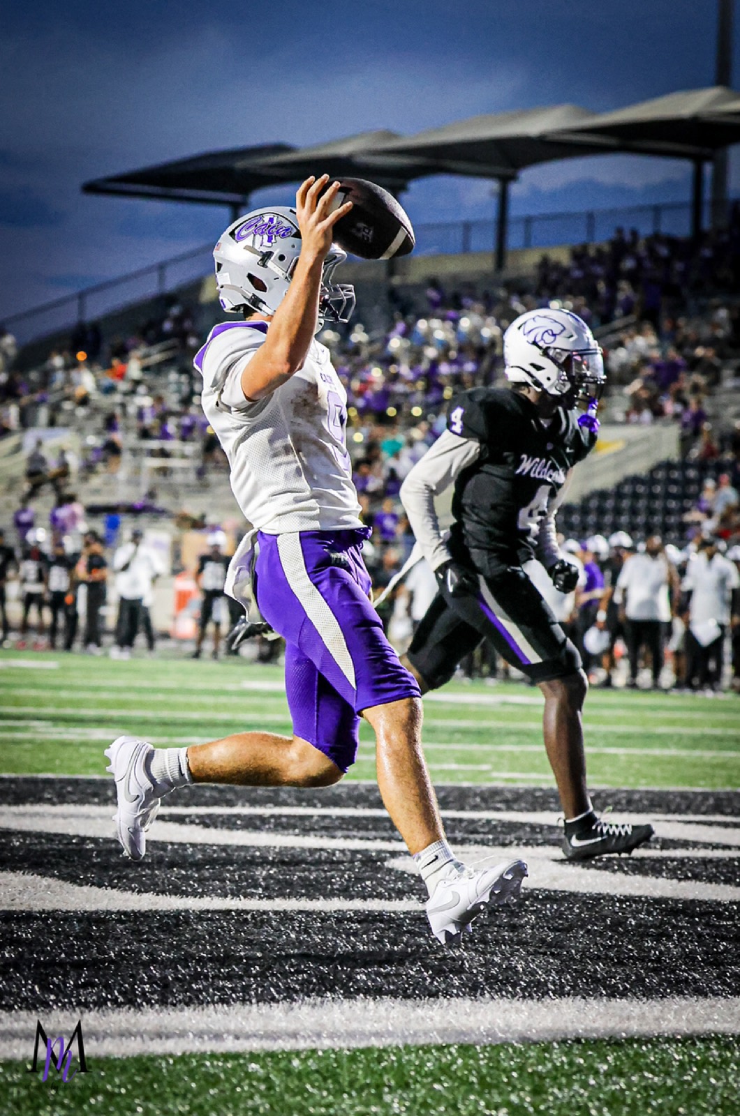 Junior quarterback Jace Hanks hauls in a pass and strides into the end zone for a score