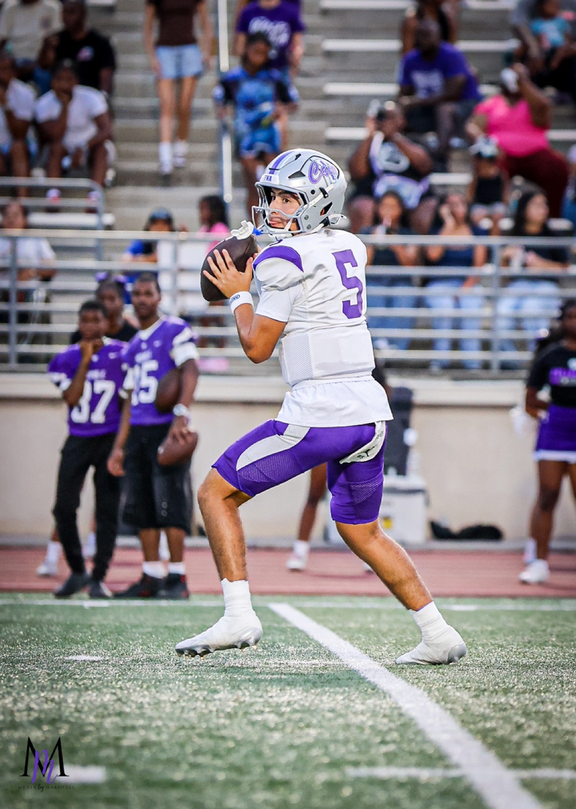 Senior quarterback Trey Reyes surveys the secondary from the pocket
