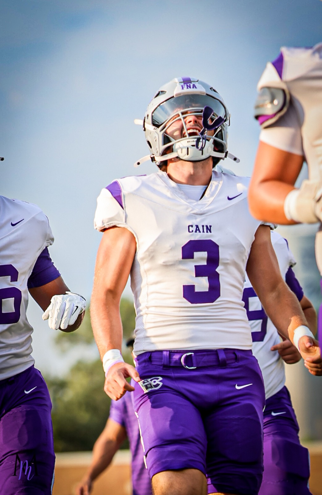 Senior tight end Wes Young looks up toward the stands on the sideline before kickoff