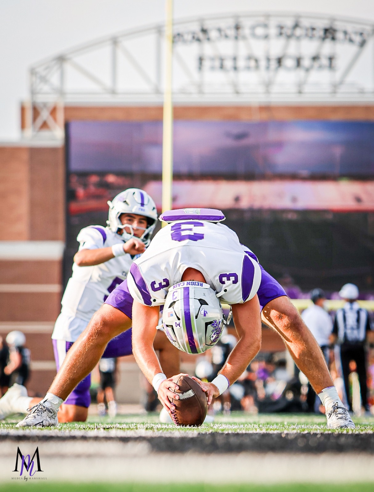 Senior tight end and long snapper Wes Young sets in deep snap stance during special teams warmups