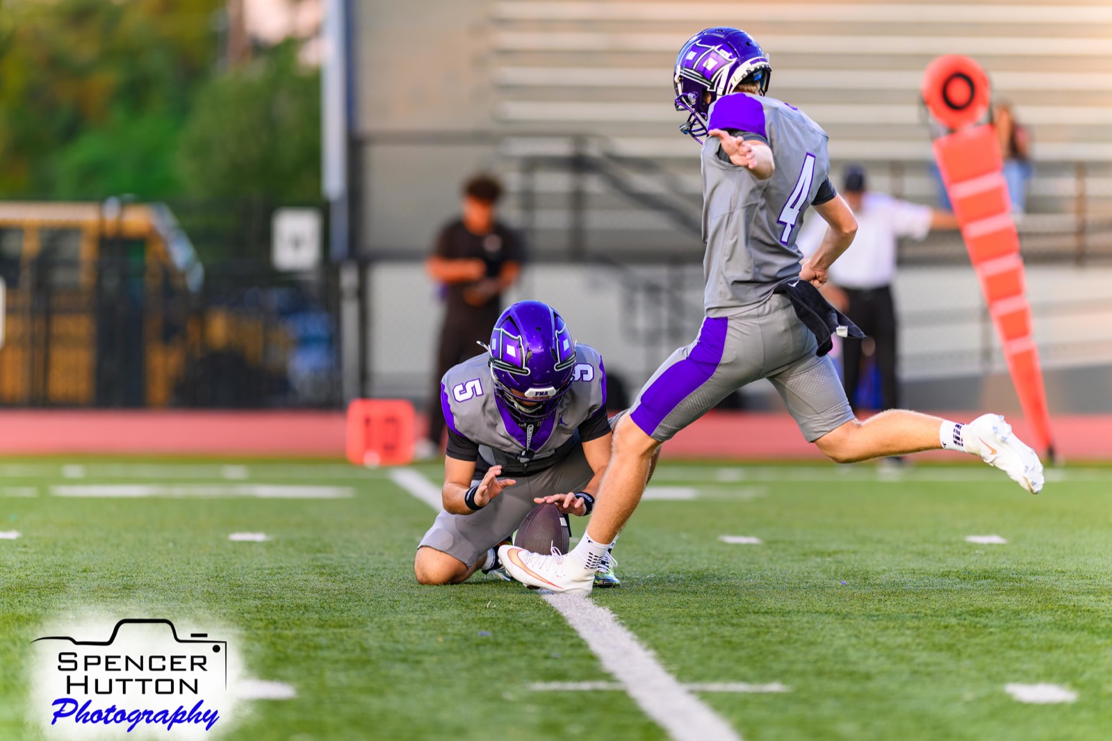 Senior kicker Sage DesAutels boots a field goal from the hold of senior quarterback Trey Reyes