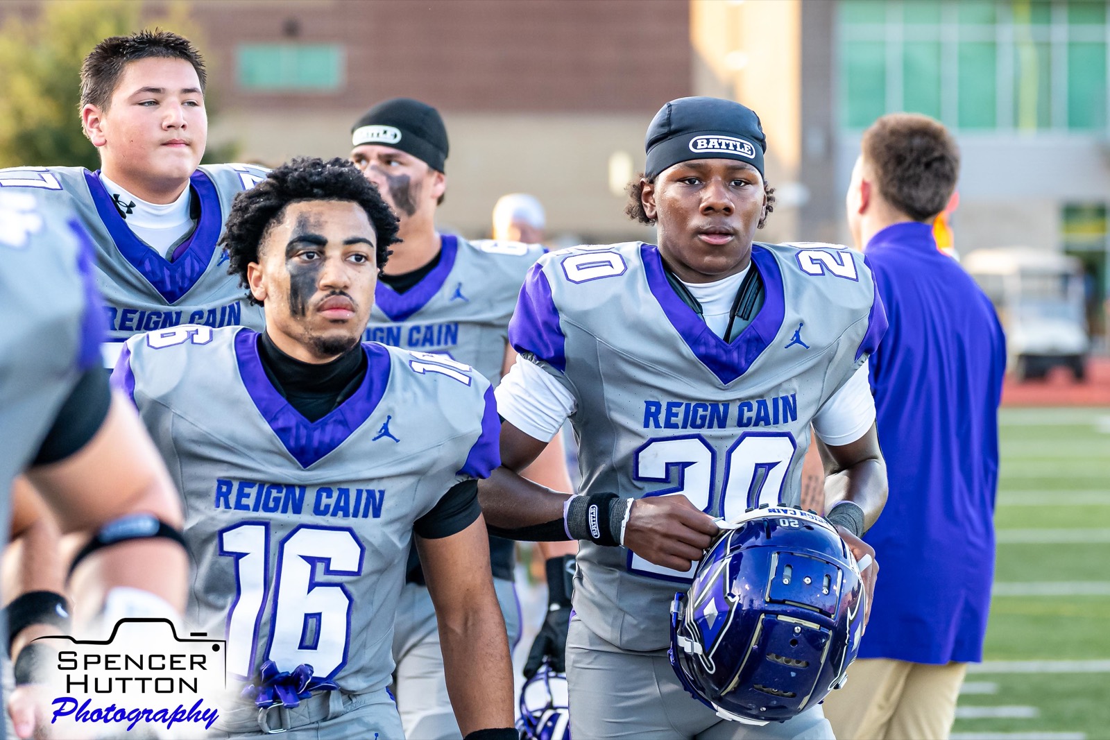Senior running back Eyan Johnson and junior running back Braylon Francis walk the field before kickoff