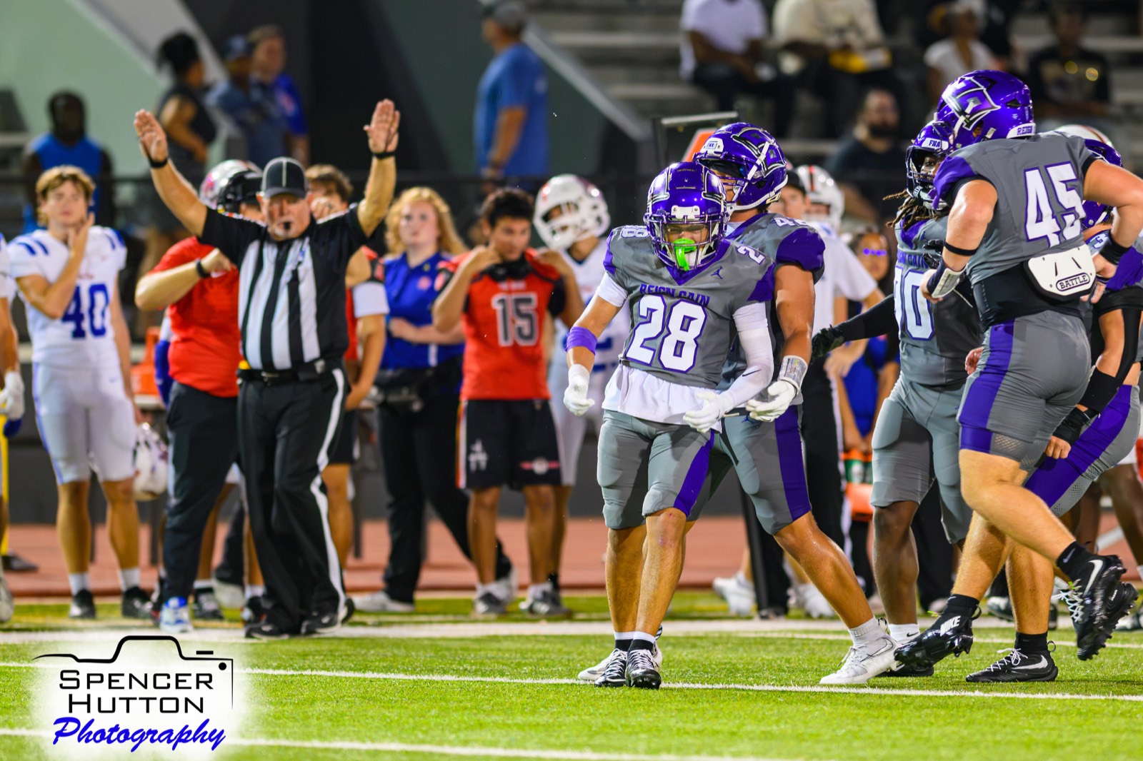 Senior defensive back Jaiden Pacheco celebrates as the official signals a touchdown