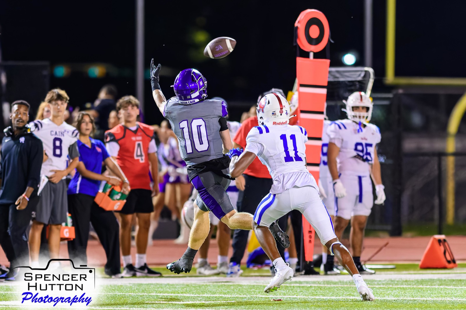 Senior wide receiver Cooper Karns reaches up for a contested catch along the sideline