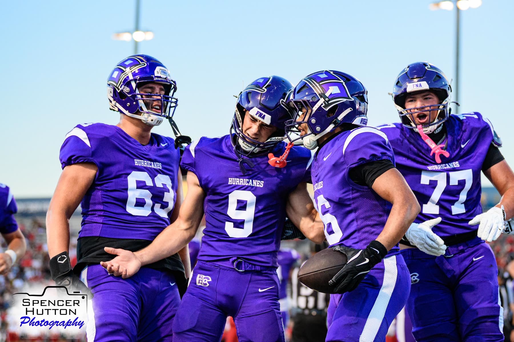 Quarterback Jace Hanks celebrates with running back Eyan Johnson and offensive linemen Clayton Rightmer and Austin Corson