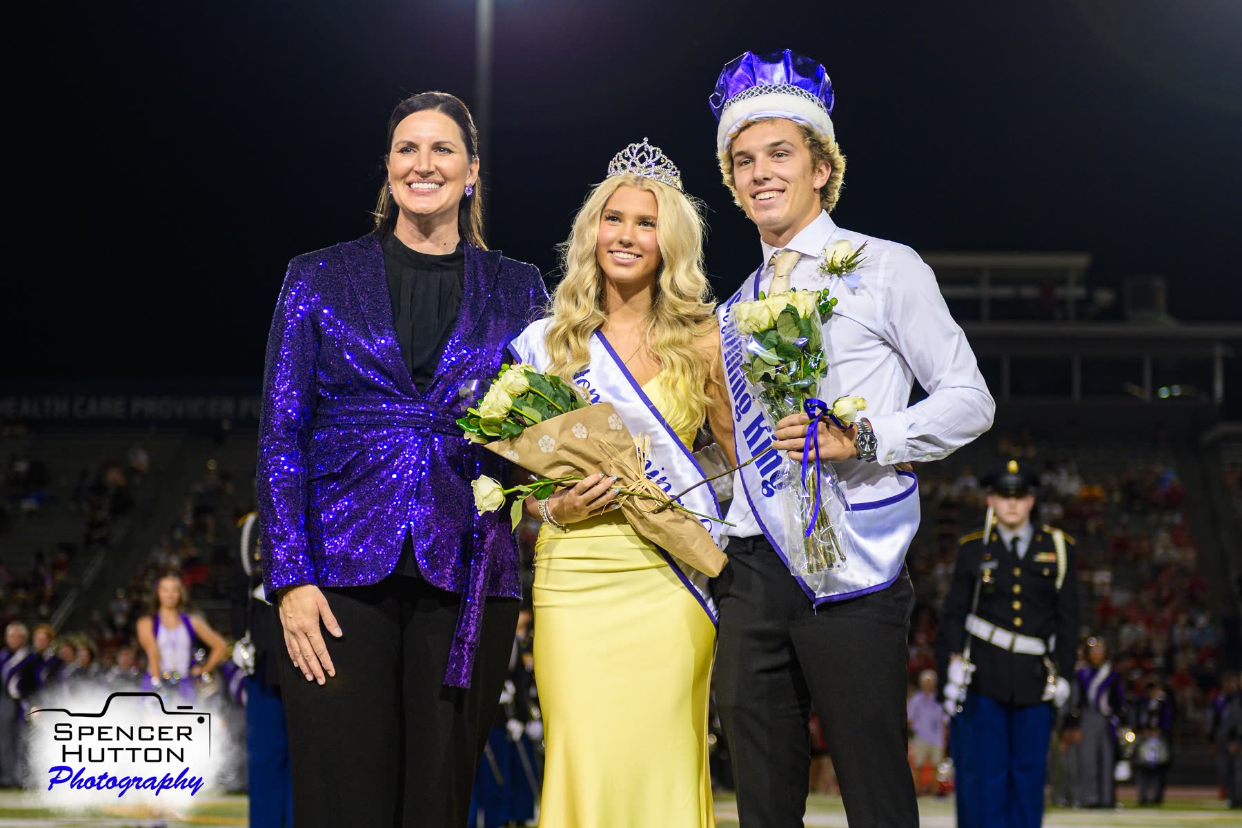 Klein Cain Principal Lauren Marti poses with the 2026 Homecoming King and Queen on the field