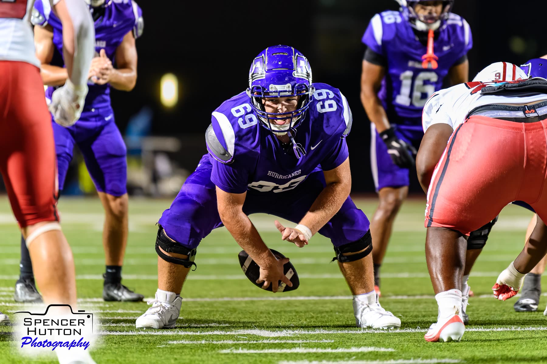 Junior center Gavin Chaloupka sets over the football at the line of scrimmage with Eyan Johnson in the backfield