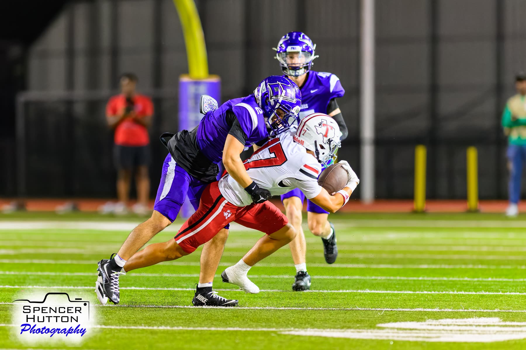 Senior defensive back Michael Elhindi makes an open-field tackle on a Tomball receiver